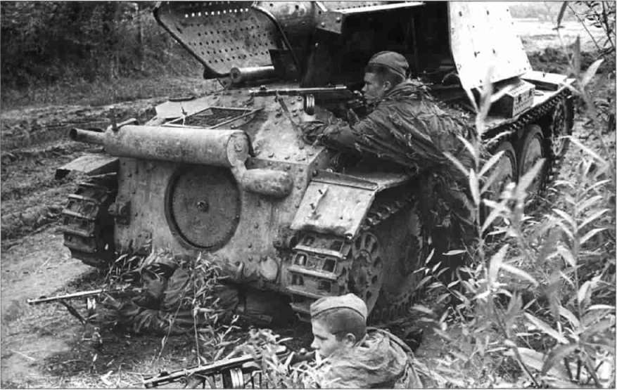 Russian soldiers near the knocked out Marder III