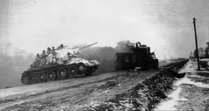 Soviet tank T-34 and dead German panzer PzKpfw.VI Tiger photo
